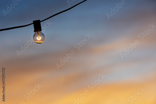 Outdoor party light against sky at dusk