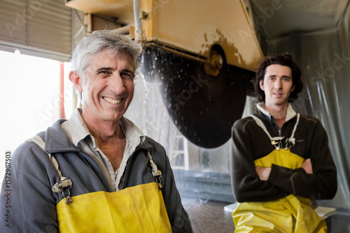 Portrait of father and son stone carvers
