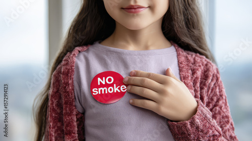 Wallpaper Mural Young Girl Wearing No Smoking Campaign Badge While Promoting Health Awareness by a Window Torontodigital.ca