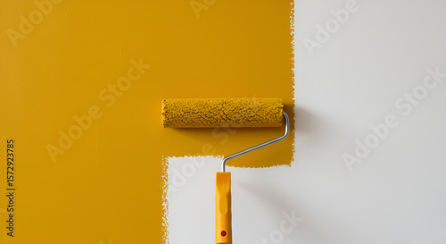 Painting Wall with Yellow Paint Roller