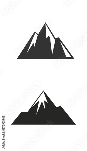 Dark grey mountain peaks with white accents summit snow