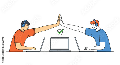 Two individuals collaborate on laptops giving a high five celebrating success and teamwork