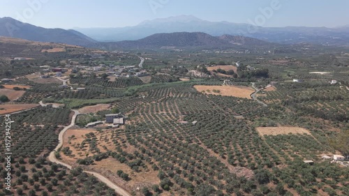 Fly with my drone along the North Crete part of the island with the nature rocks and the crystal clear water and olive tree landscape