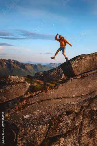 Man athlete trail running in mountains travel extreme adventure outdoor, healthy lifestyle active vacations in Norway brave runner training endurance motivation hiking solo