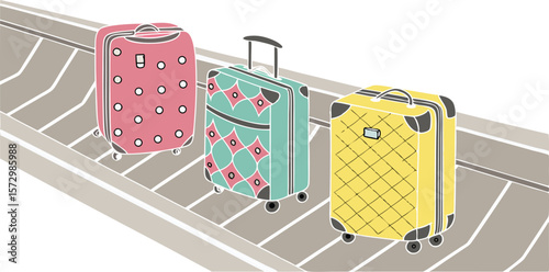 Three colorful patterned rolling suitcases with extended handles sit on an airport baggage carousel ready for travel