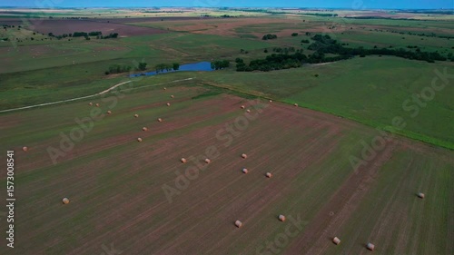 Aerial shot of hay bales in field in Kansas