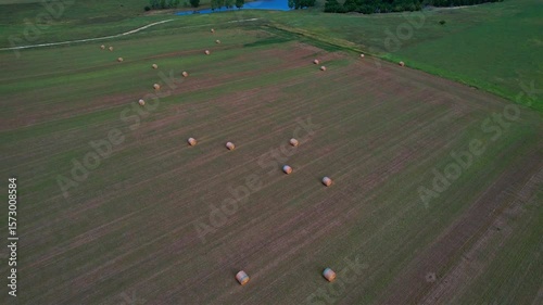 Aerial shot of hay bales in field in Kansas