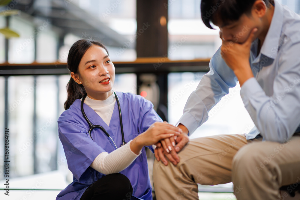 Fototapeta premium Female nurse hold her man patient's hand. Concept of giving Support. 