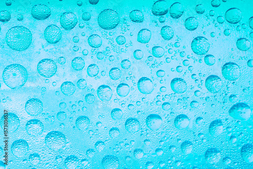 The close up image, Texture pattern of water drops over the light blue background