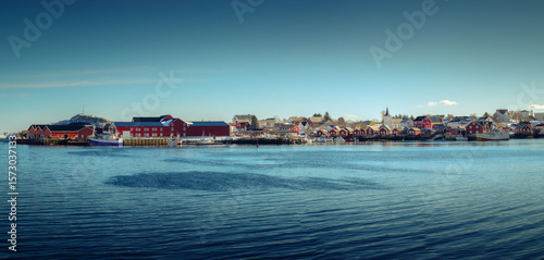 Scenic Reine town with fishing village and ship  at harbor in Lofoten Islands
