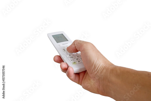 Hand holding remote control for air conditioner isolated on white background. Finger pressing button on remote control