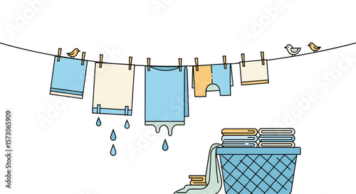 Clothes drying on a clothesline with a basket of laundry nearby on a sunny day after washing clothes