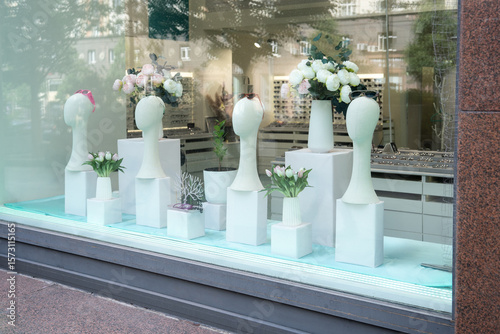An Elegant Flower Display showcased beautifully in the window of a Modern Shop setting