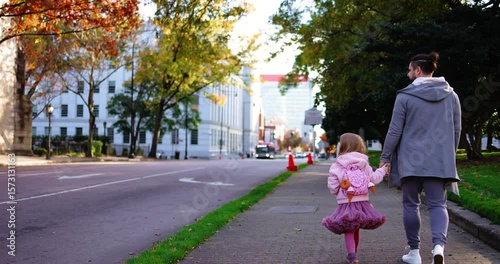 Wallpaper Mural Father and Daughter Strolling Through City Street on a Fall Day - Relaxed Family Walk with Autumn Vibes Torontodigital.ca