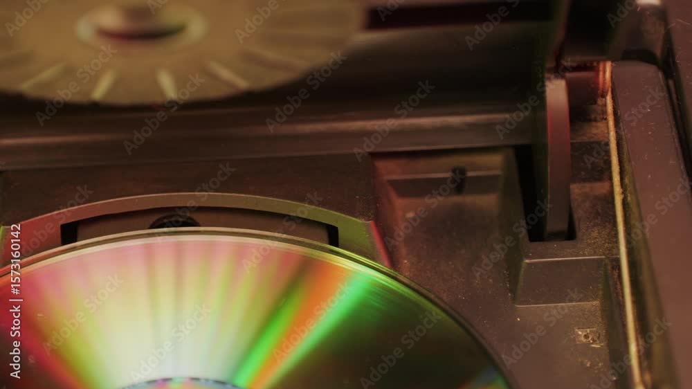 Vintage cd music player with disk inside close-up. Using portable music player for listening with compact disc