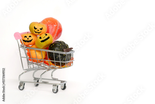 A HalloweenThemed Shopping Cart that Features Decorative Pumpkins for the Festive Season