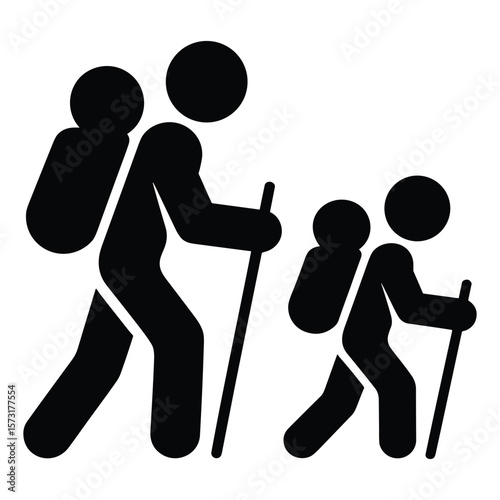 Two hikers with backpacks and walking sticks silhouette