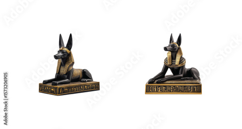 Ancient anubis statues with gold details and hieroglyphics