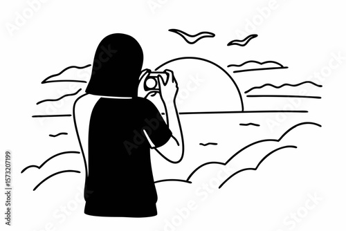 Person photographing sunset over ocean camera waves