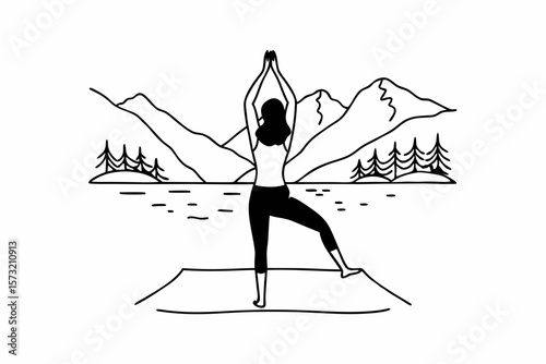 Woman practicing yoga with mountain and lake backdrop mountains trees
