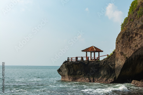 Beautiful view of the sea with a pavilion on top of a coral mountain