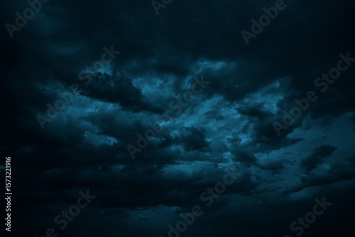 Dramatic sky with clouds. Black dark blue green night sky. Thunderstorm storm. Ominous,  frightening. 