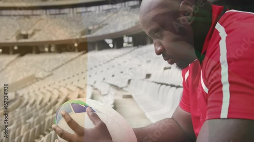 Rugby athlete bringing ball to lap, rotating it while animated panel highlighting aiding inspection
