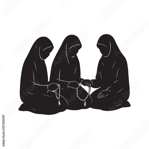 Three muslim women in hijabs praying together using prayer beads