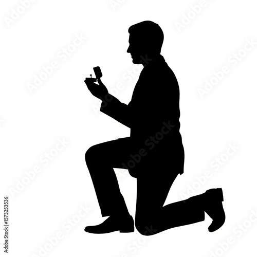 Silhouette of Man Proposing with Engagement Ring