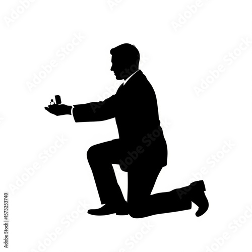 Proposal Silhouette: Man on Knee Offering Engagement Ring