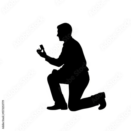 Proposal Silhouette: Man on Knee with Engagement Ring