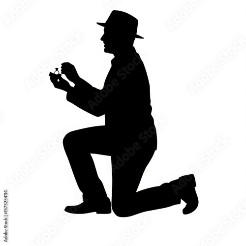 Silhouette of a Man Proposing with Engagement Ring