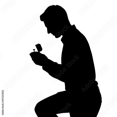 Silhouette of a Man Proposing with Ring