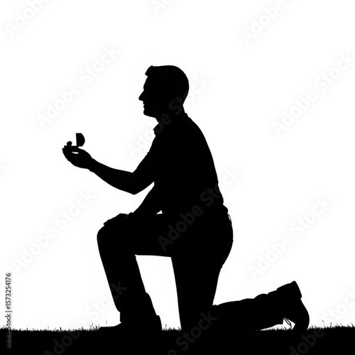 Silhouette of Man Proposing with Ring