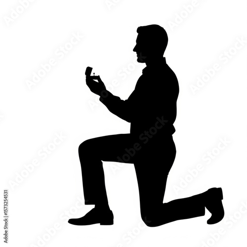 Silhouette of Man Proposing with Engagement Ring
