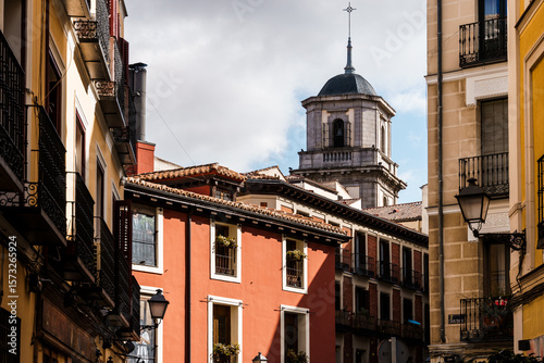 Charming architecture in Madrid, with a view of historic buildings and a church tower.
