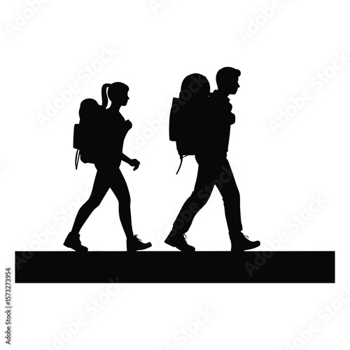 Couple hiking together on a path with backpacks silhouette