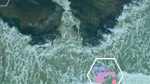 Opening top-down drone shot showing rocky shore, floating hex icons animating environmental data