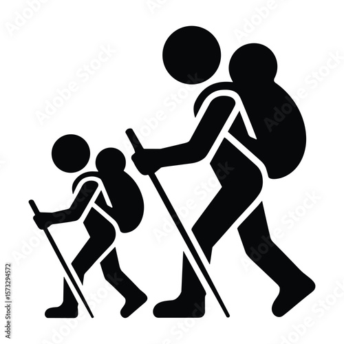 Two hikers with backpacks and trekking poles walking together silhouette