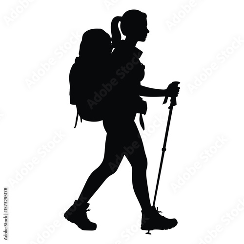 Woman hiker with backpack and trekking poles walking silhouette