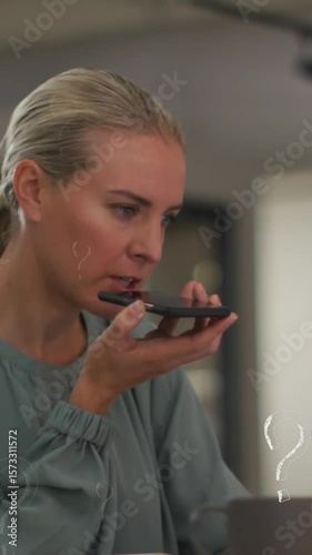 Animation of question marks over caucasian businesswoman working at office