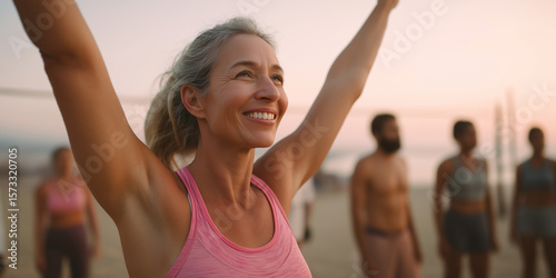 Joyful Woman Celebrating a Successful Beach Volleyball Game at Sunset