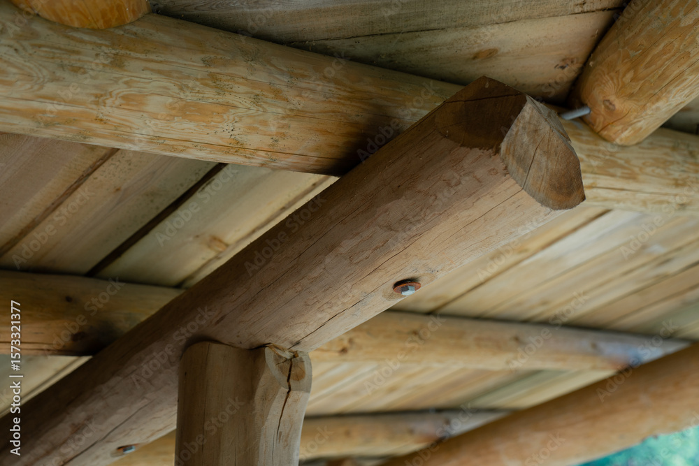 Wooden log roof construction detail showing traditional timber joinery beams and planks in rustic architecture sustainable natural building materials eco friendly craftwork design Wooden log roof construction detail showing traditional timber joinery beams and planks in rustic architecture sustainable natural building materials eco friendly craftwork design