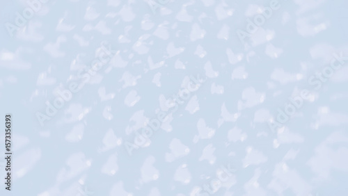 Abstract light blue background with subtle, scattered white and light-colored bokeh shapes, creating a soft, dreamy, and ethereal visual. Ideal for calming or delicate designs.