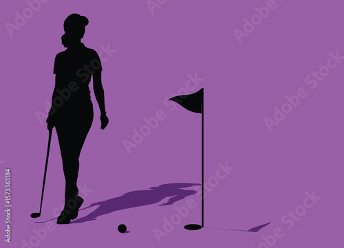 Golfer walking on the green towards the hole with putter