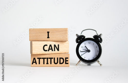 I Can Attitude symbol. Wooden blocks with words I Can Attitude. Beautiful white background with alarm clock. Business and I Can Attitude concept. Copy space.