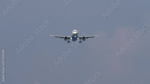 Passenger jet flying overhead during final descent and landing approach