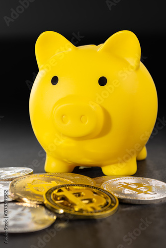 Yellow Piggy Bank with Bitcoin Coins on Gray Background