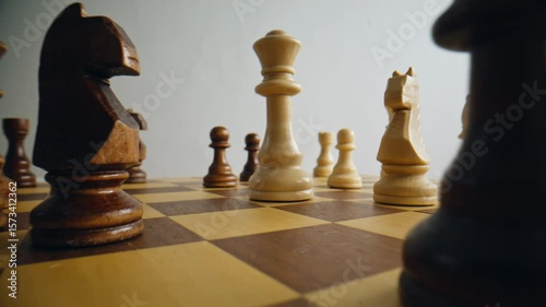 Closeup hand moving pawn piece chess board. Person playing logic strategy game