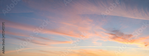 Quadro em tela feathery light pink clouds and orange shine, sky background at sunset